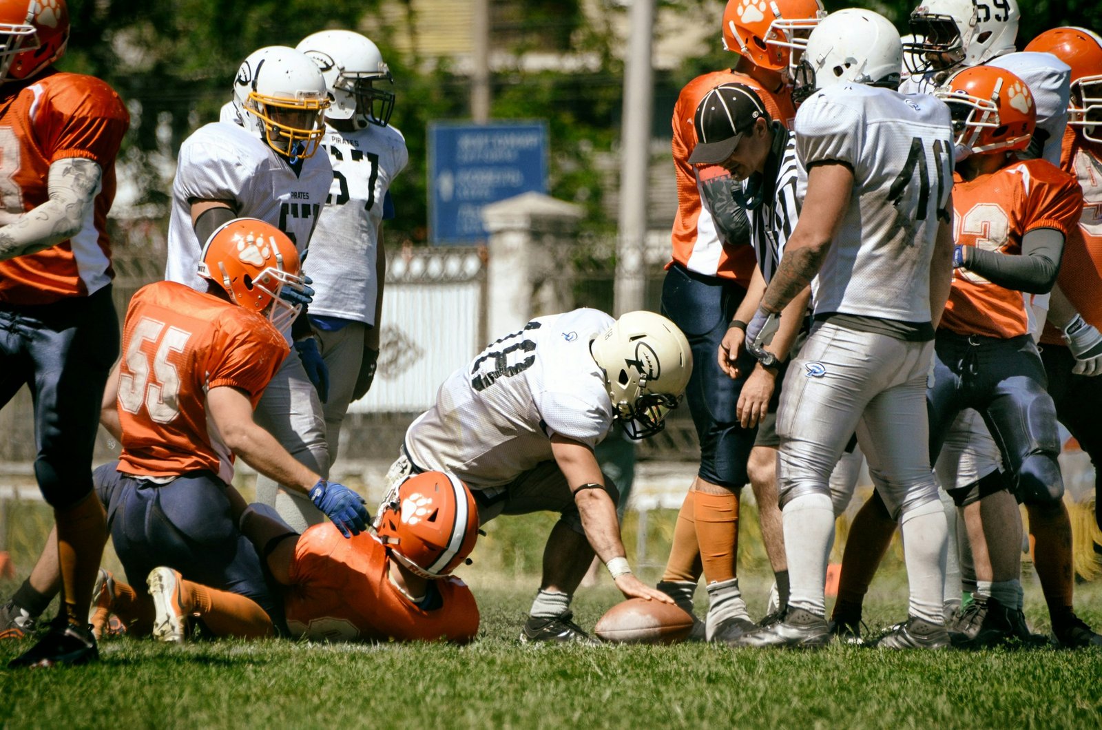Group of American football players standing together on a marked field